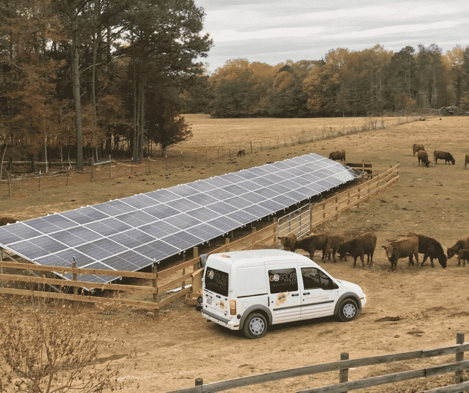 Go Solar Power Van in front of Solar Ground Mount