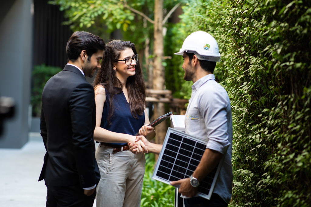 lady shaking hands with go solar power technician