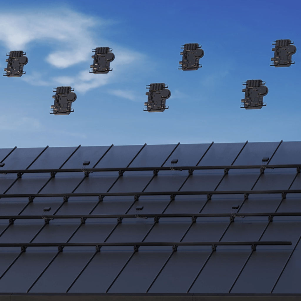Closeup of Enphase Microinverters over a solar panel mount.