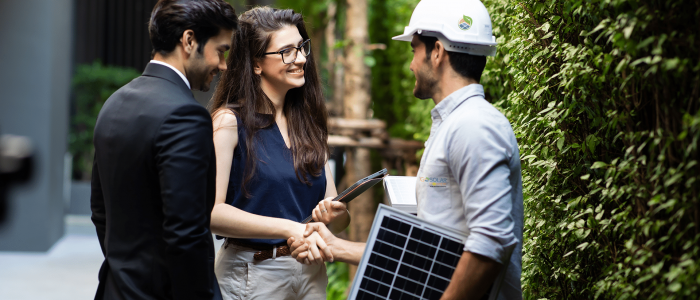 lady shaking hands with go solar power technician