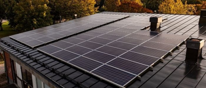 sunsetting reflecting off solar panels