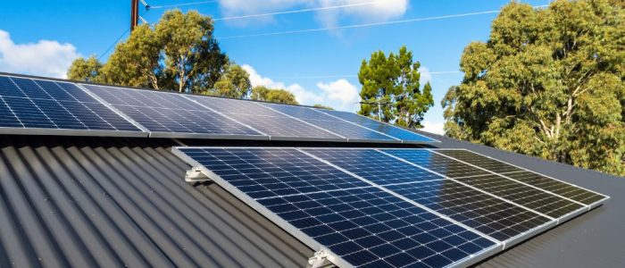 close up of solar panels on a dark gray roof